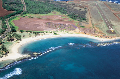 Aerial view of Salt Pond Beach Park in Hanapepe, Kauai, where Hawaiians since the 1600s have dried a red-dish sea salt in shallow red-clay pans.