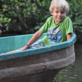 mat salleh kid infront of the boat in sungai kinabatangan by Justani Joni - Babies & Children Child Portraits