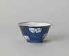 Bell-shaped cup with powder blue and flower heads in reserve