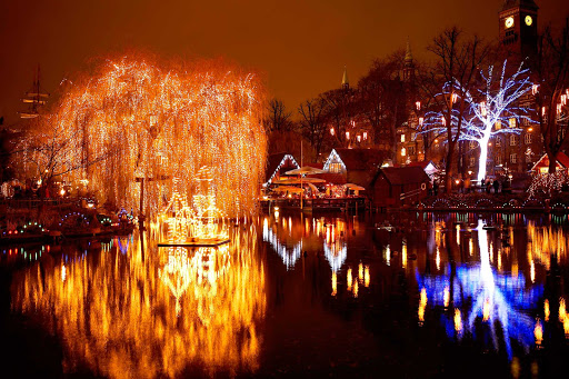 Christmas-Tivoli-Lake-Copenhagen - Christmastime in Copenhagen's Tivoli Lake, part of Tivoli Gardens, which opened in 1843, making it the second oldest amusement park in the world.