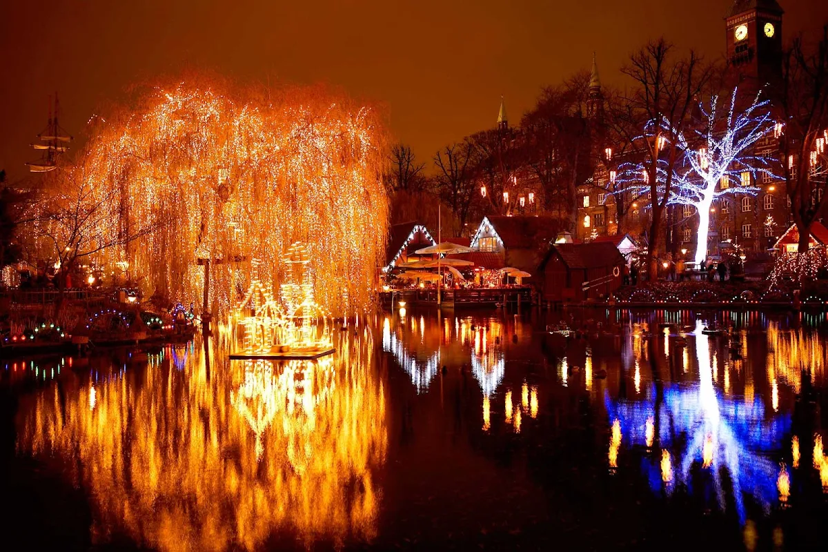 Christmas-Tivoli-Lake-Copenhagen - Christmastime in Copenhagen's Tivoli Lake, part of Tivoli Gardens, which opened in 1843, making it the second oldest amusement park in the world.