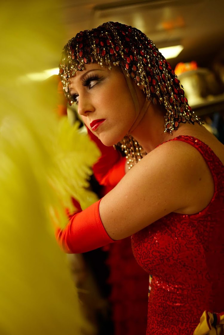 Backstage on a Crystal cruise, a dancer gets ready for an evening performance.