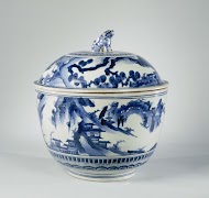 Large covered bowl wit a continuous landscape with pavillions, mountains and trees