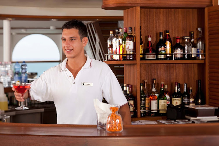 At the Sky Bar on Seabourn Sojourn, you'll find open air drinking,  entertainment and attentive