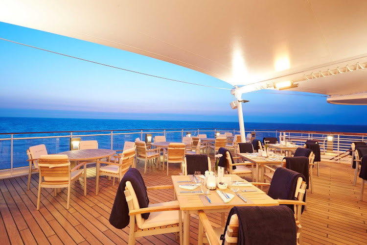 Enjoy the ocean views and salty sea breeze from the Yacht Club terrace aboard Europa 2.