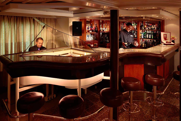 Gather around the Piano Bar and meet new people during your SeaDream sailing. 