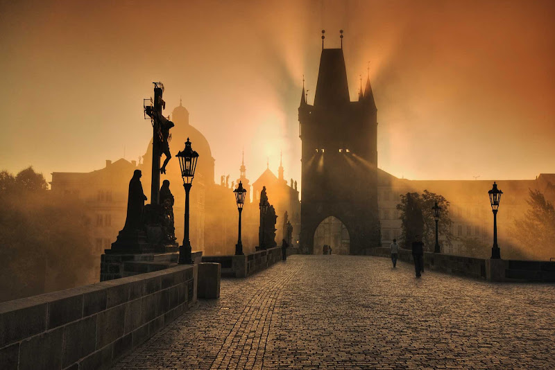 The medieval Charles Bridge in Prague, the Czech Republic, at sunrise,
