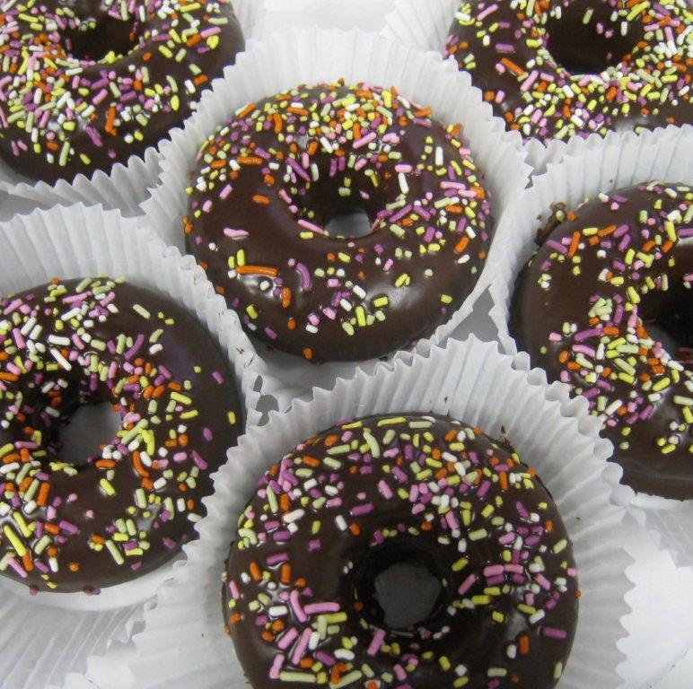 Vanilla Doughnuts dipped in Dark Chocolate Ganache and covered in sprinkles. Available Saturday Morn