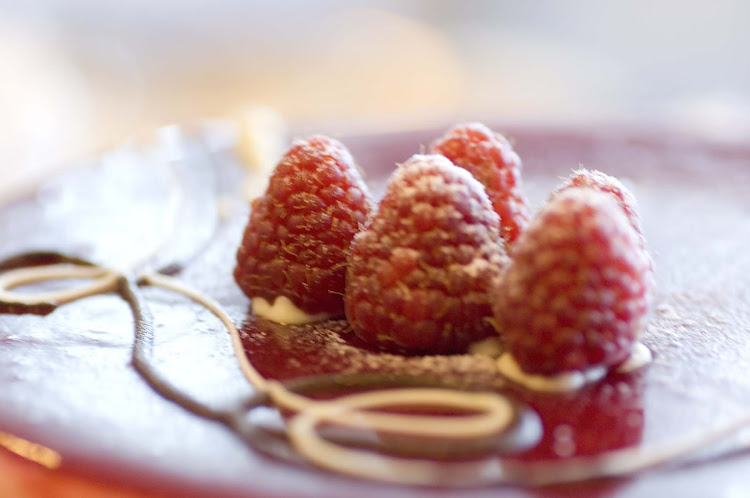 A raspberry dessert creates a smooth finish to you culinary experience on Crystal Serenity.