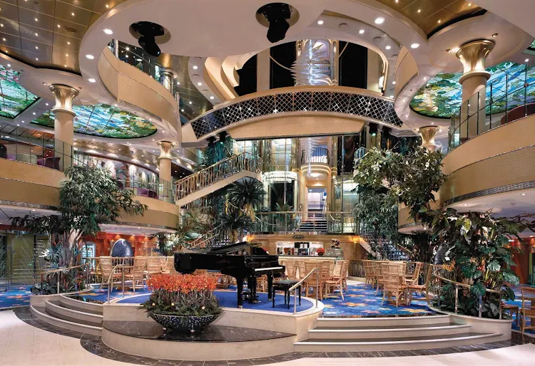 The atrium on Norwegian Dawn conveys a festive atmosphere and is a great place to hang out while enjoying live piano music.