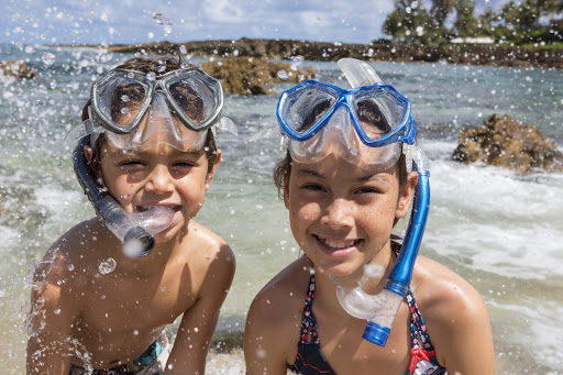 kids-snorkel-Oahu - Kids get ready to snorkel on the north shore of Oahu. 