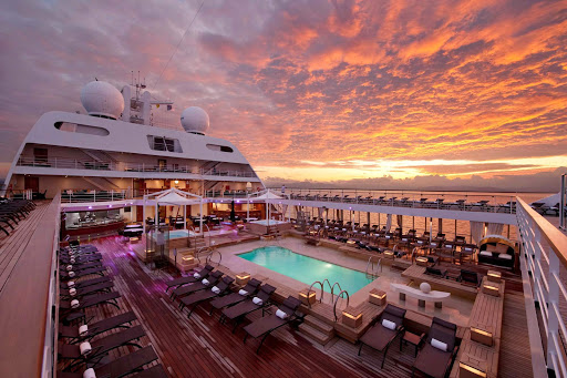 Witness the sunrise from the expansive Pool Deck on board Seabourn Odyssey.