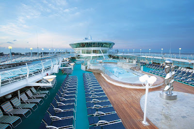 Relax, swim and soak in the rays in the adults-only Solarium aboard Enchantment of the Seas.