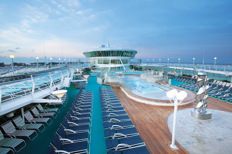 Relax, swim and soak in the rays in the adults-only Solarium aboard Enchantment of the Seas.