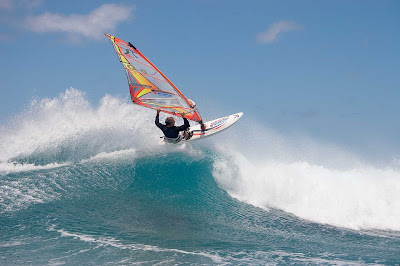 Peter Garzke, a professional windsurfer from Germany, does an aerial off the coast of Honolulu. 