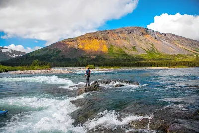 Bait casting in the rapids in a national park in Quebec, Canada.