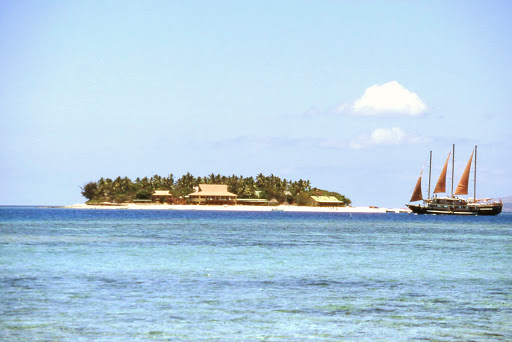 The Tui Tai, a sail cruiser, passes by Treasure Island, one of five resort islands in the Mamanuca group. The shot was taken from Beachcomber Island.