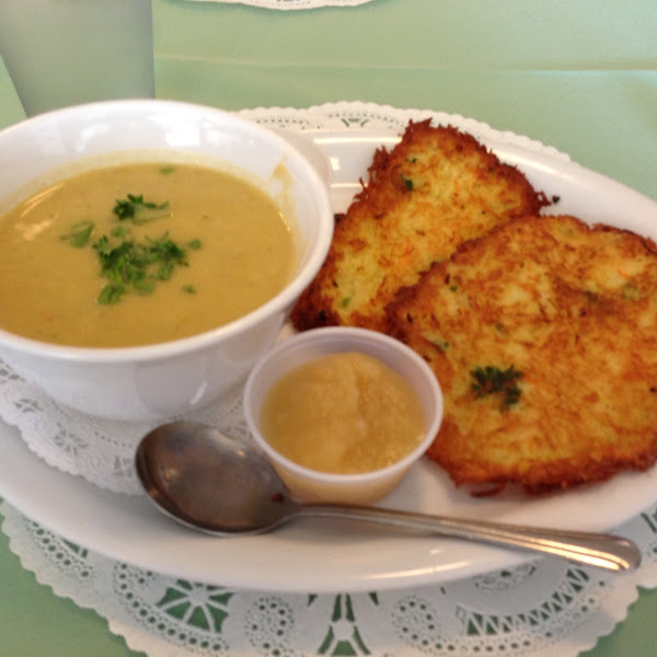 Potato Pancakes with applesauce and sour cream, and a cup of soup.