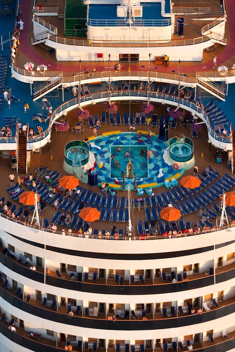 Play in the pool, soak in a hot tub or lounge in a deck chair with a cool drink on your Carnival Dream cruise.