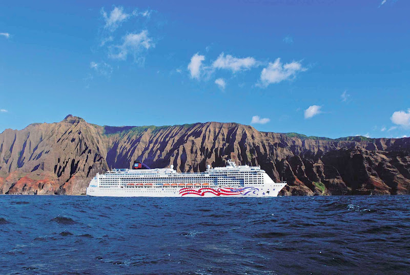 Cruise to Kauai, Hawaii, and experience the beauty of Na Pali Coast's green cliffs and splendid waterfalls.