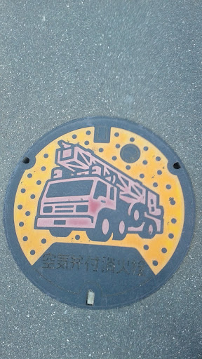 Manhole art of firetruck