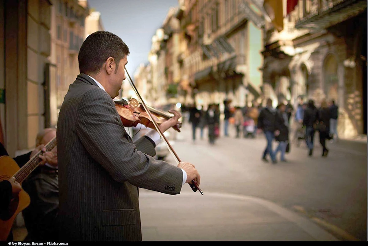 violinist-rome-italy - A pinstriped violinist on Via del Corso in Rome.