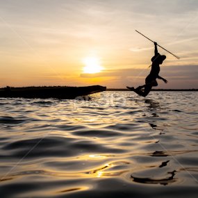 sunset fishing by Jakkree Thampitakkul - People Family