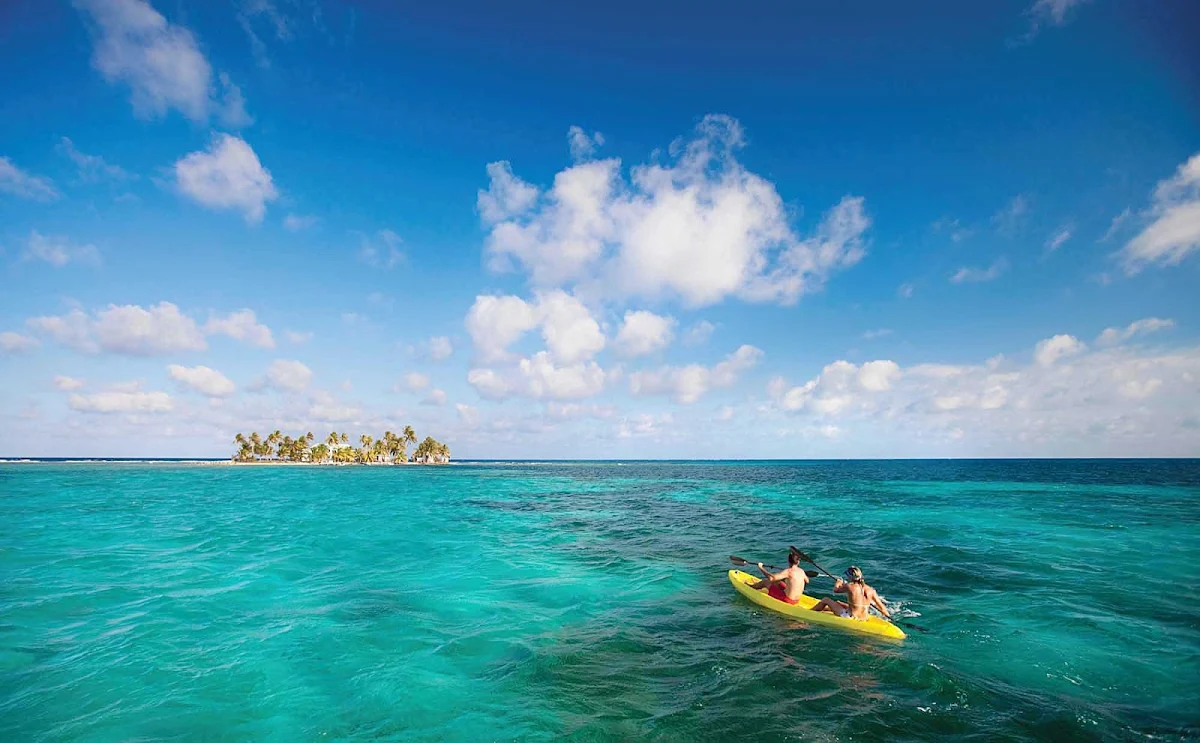 Caribbean-lagoon-couple - Kayaking, snorkeling and other adventures await when you book passage to the Caribbean on Norwegian Cruise Lines.