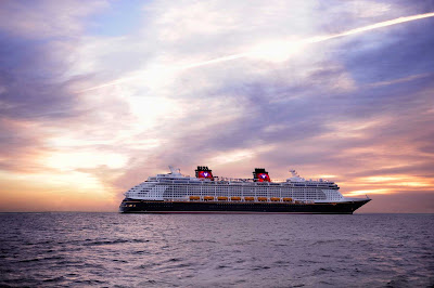Disney Dream against the backdrop of a Caribbean sunset.