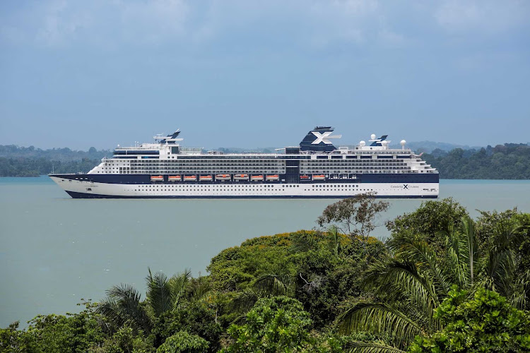 The 2,170 passenger Celebrity Infinity sails down the Panama Canal.