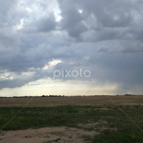Storm clouds at the cemetry by Linda Poessnecker - Landscapes Cloud Formations
