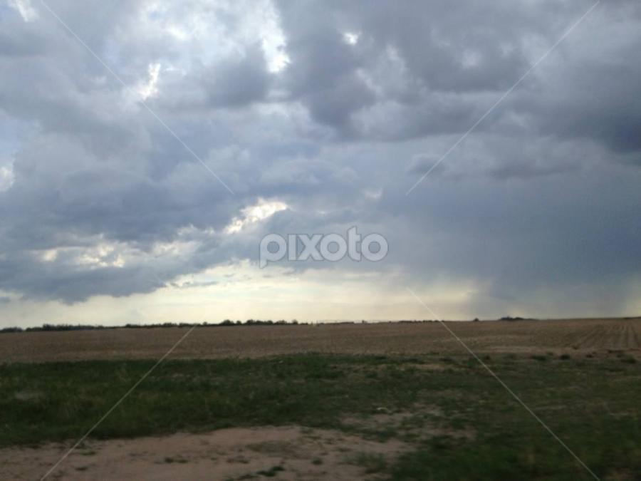 Storm clouds at the cemetry by Linda Poessnecker - Landscapes Cloud Formations