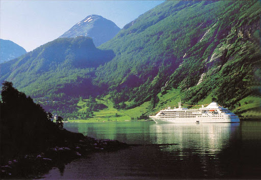 Silver Cloud cuts through a fjord in Norway, one of the breathtaking destinations along the ship's global itinerary.